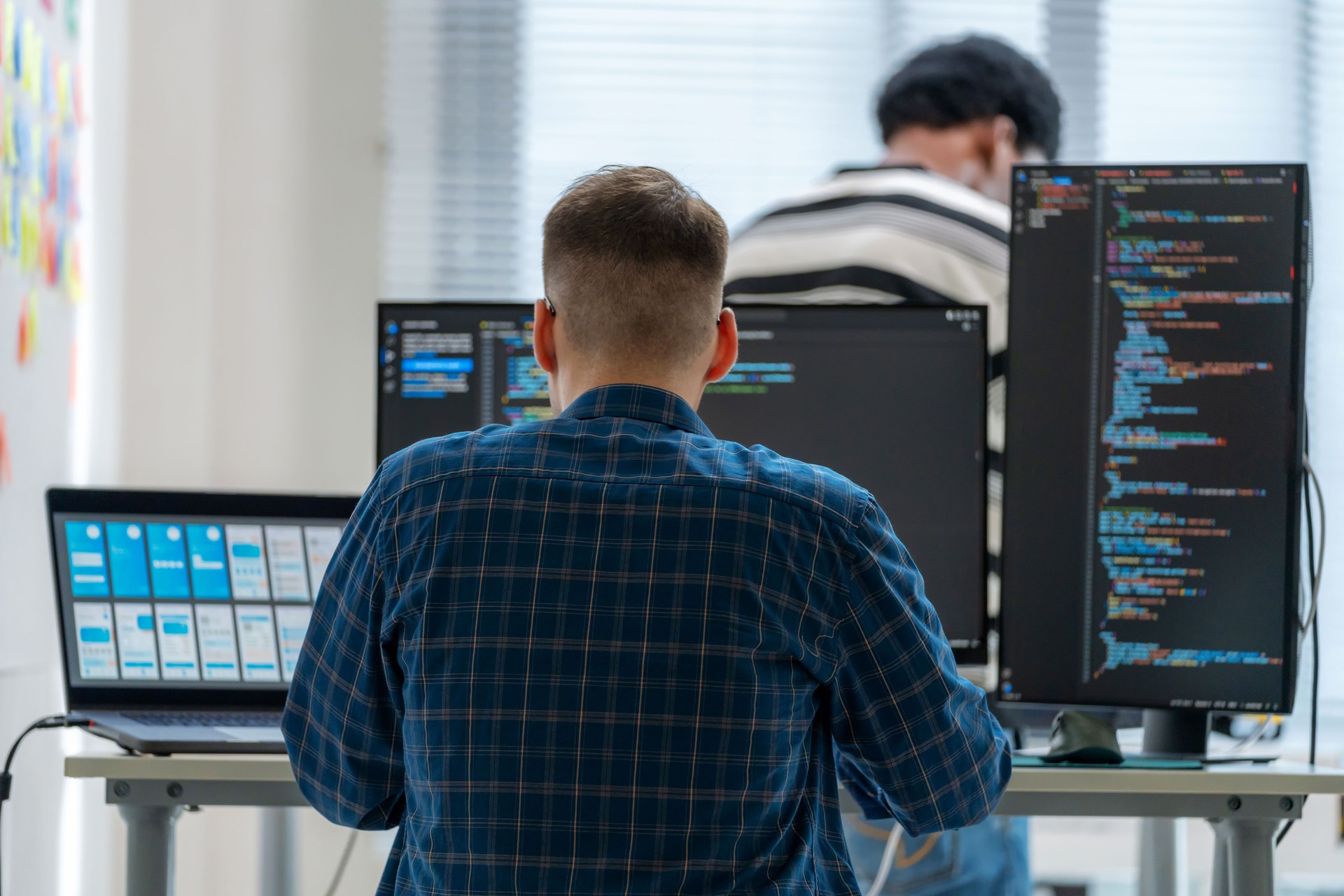 Team of IT supporters collaborate in a modern data center, focused on discussing computer language and web support solutions, including HTML. The atmosphere is charged with innovation as they explore the latest in AI and cloud technology.